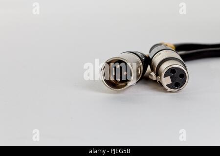Male and Femlae XLR connectors on a microphone lead cable Stock Photo