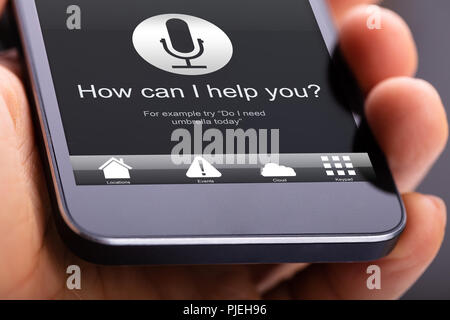 Person Using Voice Recognition Function On Mobile Phone Stock Photo