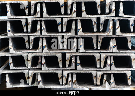 Steel channels stacked in an interlaced pattern Stock Photo
