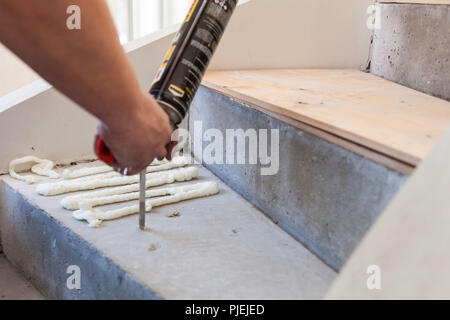 Production and installation of flax. Work of the master. Stock Photo