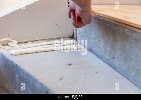 Production and installation of flax. Work of the master. Stock Photo
