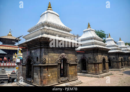 Votive temples and shrines in a row at Pashupatinath Temple, Kathmandu, Nepal - Sri Pashupatinath Temple located on the banks of the Bagmati River. Stock Photo