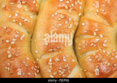 Freshly baked roll pastry with sesame Stock Photo