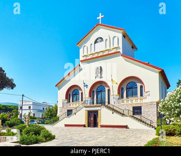 Kos, Greece - July 3, 2018. Principal facade of The Church of Evangelismos, Kos Town Cathedral. View from Vasileos Georgiou street. South Aegean. Stock Photo