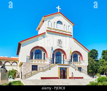 Kos, Greece - July 3, 2018. Principal facade of The Church of Evangelismos, Kos Town Cathedral. View from Vasileos Georgiou street. South Aegean. Stock Photo