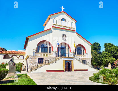 Kos, Greece - July 3, 2018. Principal facade of The Church of Evangelismos, Kos Town Cathedral. View from Vasileos Georgiou street. South Aegean. Stock Photo