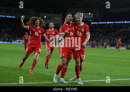 Cardiff, UK. 6th September 2018. Connor Roberts of Wales (14) celebrates with teammate David Brooks (13) after he scores his teams 4th goal.  UEFA Nations League match, Wales v Republic of Ireland at the Cardiff city Stadium in Cardiff , South Wales on Thursday 6th September 2018. picture by Andrew Orchard/Alamy Live News Stock Photo