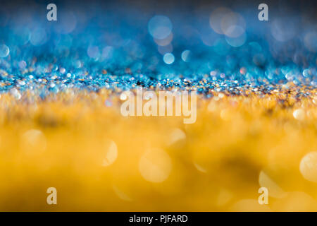 Patriotic Yellow-blue bokeh on a black background. The Ukrainian flag. Defocused. Free space for text. Stock Photo