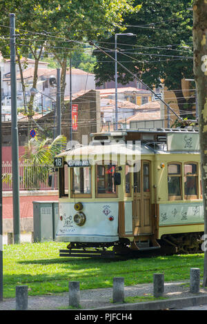 PORTO, PORTUGAL - JULY 20, 2017: Tourist tram that runs along the banks of the river Douro between the neighborhoods of Ribeira and Foz. Stock Photo