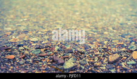 Banner Natural abstract background of sea pebbles. Decorative textured backdrop. Stock Photo