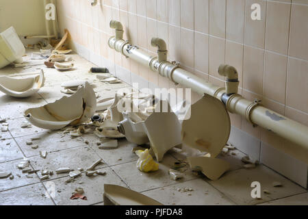 Toilets in an abandoned empty factory in Magdeburg Stock Photo