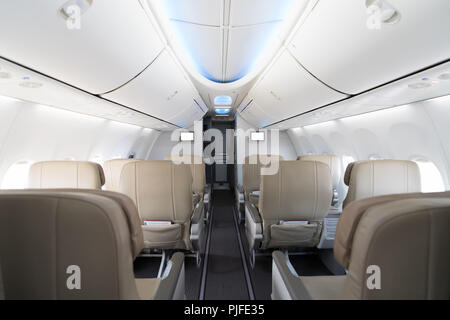 Empty passenger airplane seats in cabin. Interior in modern airplane. Stock Photo