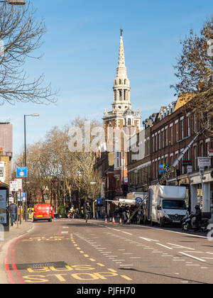 London, England, UK - February 12, 2018: Deliveries are made to shops and houses along the main Upper Street through Islington, London, with the spire Stock Photo