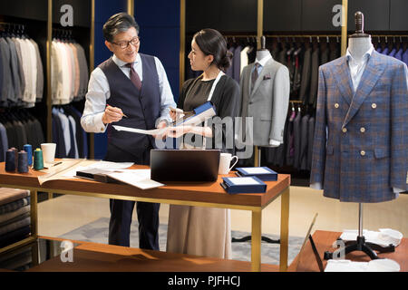 Confident fashion designers working Stock Photo
