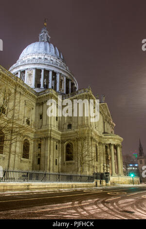 London, England, UK - February 28, 2018: Snow falls on St Paul's Cathedral during the 'beast from the east' storm in London. Stock Photo