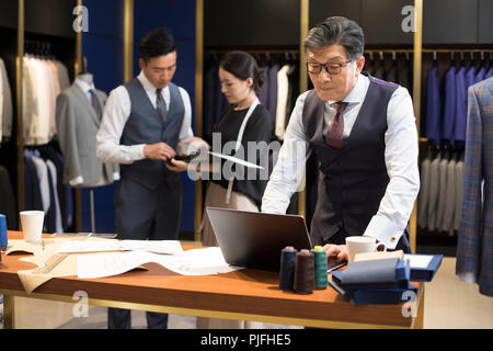 Confident fashion designers working Stock Photo