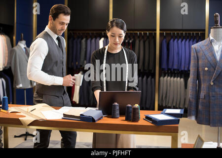 Confident fashion designers working Stock Photo