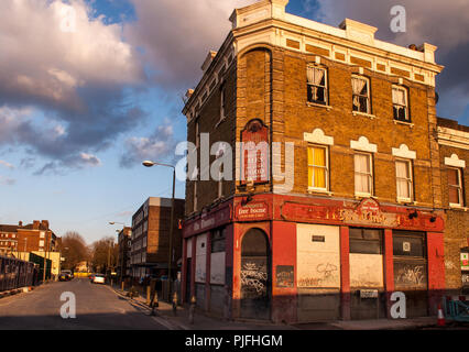 London, England, UK - April 11, 2010: A traditional pub is boarded up in the middle of partially redeveloped neighbourhood of Greenwich following the  Stock Photo