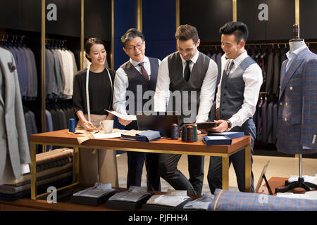 Confident fashion designers working Stock Photo