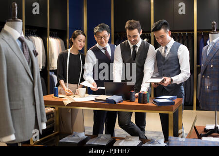 Confident fashion designers working Stock Photo