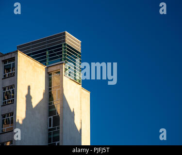 Manchester, England, UK - June 30, 2018: Evening sun casts a shadow of the Midland Hotel onto Peter House, an office block on Manchester's St Peter's  Stock Photo