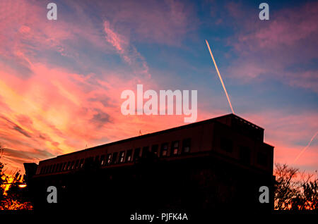 Vivid colored mystic sky, dark silhouette, ray of lights. Stock Photo