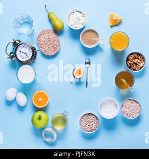 Female Hands and Useful Colorful Breakfast Coffee Milk Tea Fruits Cottage Cheese Oats Flat Lay Still Life Table Top View Blue Background Copy Space