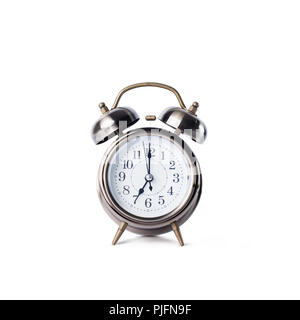 Retro classic alarm clock with bell, twin, showing seven o'clock standing on flat surface Isolated on white Copy space Stock Photo