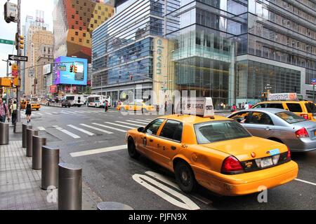 NEW YORK, USA - JULY 1, 2013: People walk along 8th Avenue in New York. Almost 19 million people live in New York City metropolitan area. Stock Photo