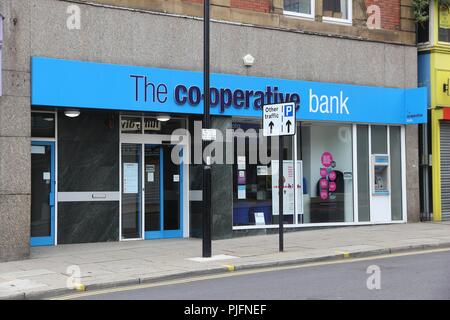 SHEFFIELD, UK - JULY 10, 2016: The Co-operative Bank branch in Sheffield, Yorkshire, UK. The bank is part of The Co-operative Group employing 70,000 p Stock Photo