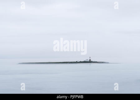 Coquet Island, of the Northumberland coast, near Amble, on a misty, overcast day, England Stock Photo