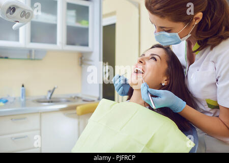 A girl with a beautiful smile with a dentist. Stock Photo