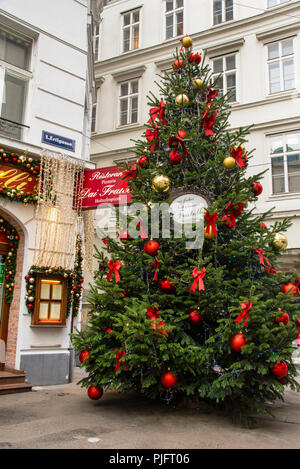 Christmas tree in red ribbons and balls in Vienna, Austria. Stock Photo