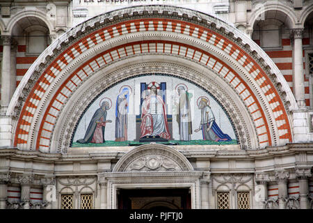 Victoria London England Westminster Cathedral North West Portal Arch Tympanum shows Mosaic depicting Saint Peter, Virgin Mary, Jesus Christ as Pantocr Stock Photo