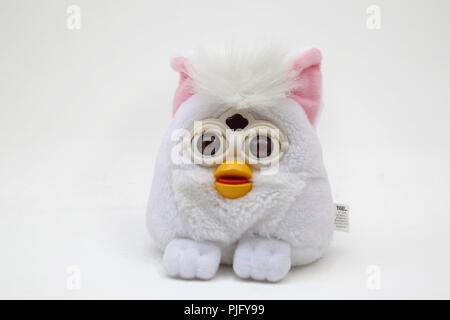 28 November 2023, Bavaria, Nuremberg: The Furby plush figures from Hasbro,  an electronic furry animal, pictured on a table at the annual press  conference of the German Toy Retail Association (BVS) and