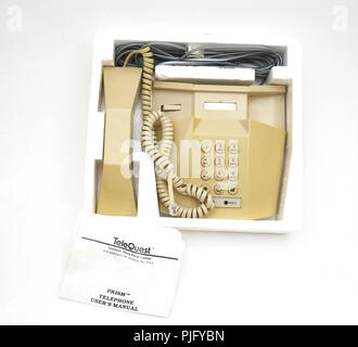 Vintage Telequest Prism Desk Telephone with Hold Button In Packaging with User's Manual Stock Photo