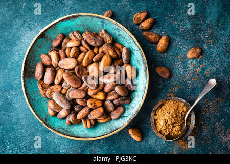 Cocoa beans and cocoa powder. Cocoa background Stock Photo