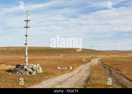 Old telegraph post at the mountain plateau 'Finnmarksvidda' in Alta, Finnmark, Norway. Stock Photo