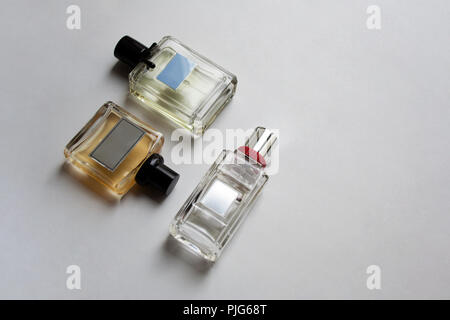 Three glass perfume bottles isolated on white background with a copy space Stock Photo