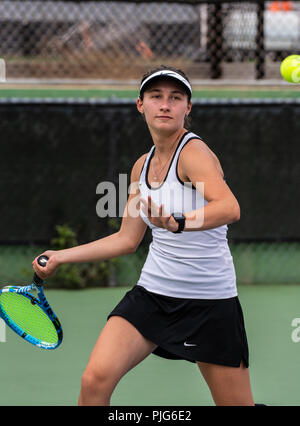 High school varsity tennis player from Foothill Tech chasing down the ball during her match against St Bonaventure on September 4, 2018. Stock Photo