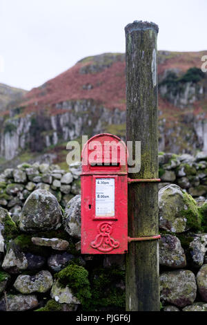 A bright red Edwardian post box with Edward VII royal cypher on a rural lane in Upper Teesdale, County Durham, England. Stock Photo