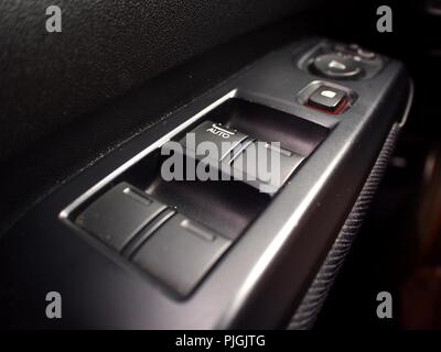 Photo of a control switch of a car's windows and side mirror Stock Photo