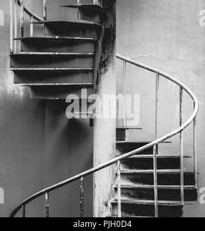 Rustic curved spiral staircase with railing close-up Stock Photo