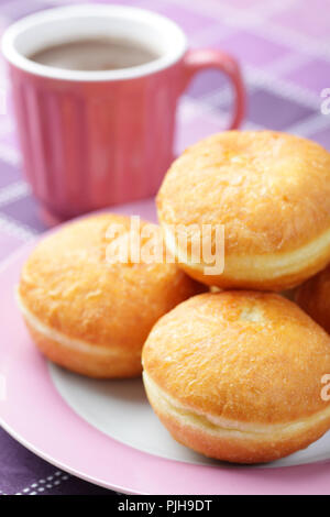 Donuts on the plate and the cup with hot chocolate Stock Photo
