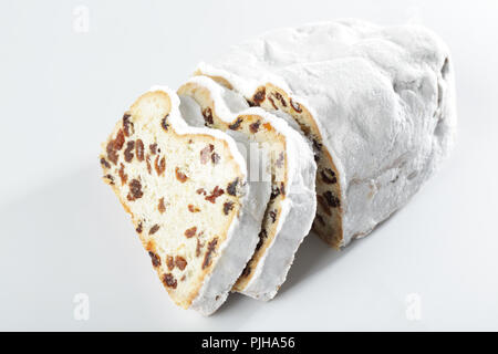 Christmas stollen with raisins closeup isolated on white background Stock Photo