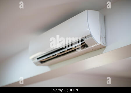 Close up of an air conditioner on a white wall Stock Photo