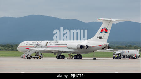 Russia, Vladivostok, 08/10/2018. Passenger airplane IL-62M of Air Koryo (North Korea) on airfield in cloudy day. Aviation and transportation. Stock Photo