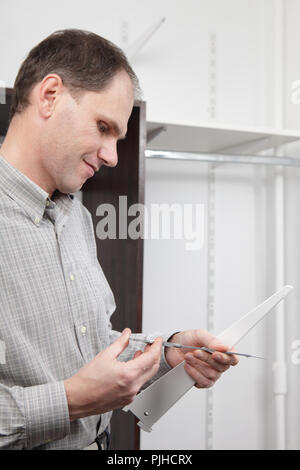 Man measuring the arm using caliper Stock Photo