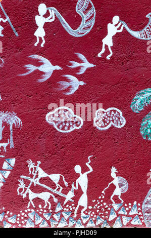 MUMBAI, INDIA – August 9 2018: Farming scenes; music being made with tradional horns and drums, depicted on a mural at a Warli temple inside the Natio Stock Photo