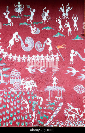 MUMBAI, INDIA – August 9 2018: farming; tradional horns and drums; dancing, depicted on a mural at a Warli temple inside Sanjay Gandhi National Park.  Stock Photo